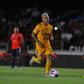 After you: Leonardo Lopez (right) of Veracruz watches Eduardo Vargas of Tigres dribble the ball into the goal