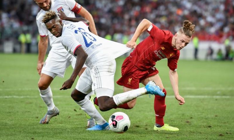 Liverpool's Harvey Elliott (R) is the youngest player to start for the club