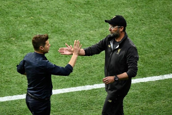 Liverpool manager Jurgen Klopp (right) and Tottenham Hotspur boss Mauricio Pochettino (left) have criticised the early closure to the Premier League transfer window