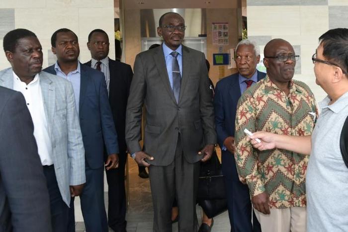 The group, including Vice President Kembo Mohadi (C), attended a private Catholic mass for Mugabe officiated by a Zimbabwean priest