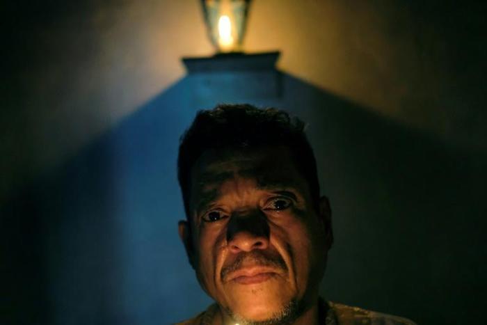 Venezuelan spiritual healer "Brother Guayanese" poses at his clinic in the Caracas neighborhood of Petare