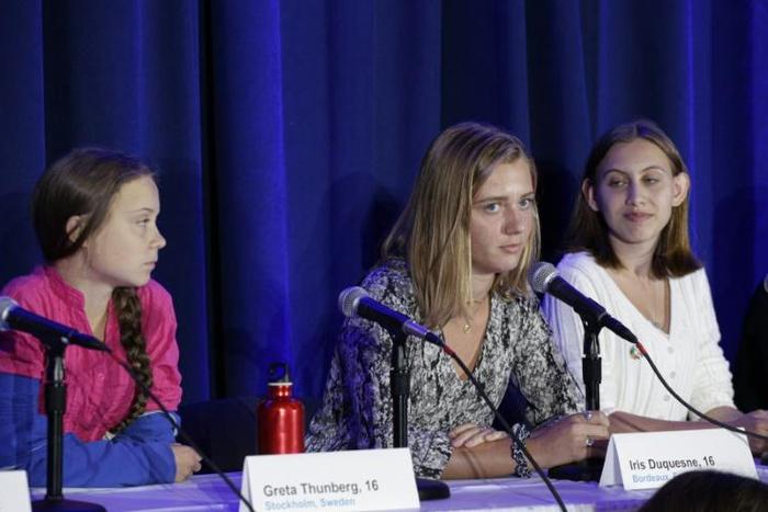 Greta Thunberg (L) and French activist Iris Duquesne (C) attend a press conference where 16 children from across the world presented their official complaint on the climate crisis to the United Nations