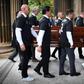 Pallbearers wore number 2 shirts with the name of Fernando Ricksen at his funeral in Glasgow on Wednesday