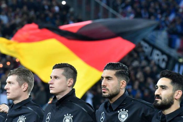 German FA boss Oliver Bierhoff says Emre Can (second from right) and Ilkay Gundogan (right) "made a mistake" by 'liking' a controversial Instagram post.