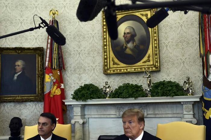 US President Donald Trump (R) meets with Brazilian President Jair Bolsonaro in the Oval Office at the White House on March 19, 2019