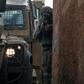 Israeli security forces have launched a manhunt for the assailant who killed two people in the occupied West Bank