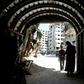 Syrians enter a tunnel leading to an underground hospital in Douma, in eartern Ghouta, a subterranean network of tunnels and makeshift wards and operating rooms beneath the former rebel enclave