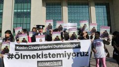 Women's rights activists gathered outside the courthouse, with a large banner reading "we don't want to die"
