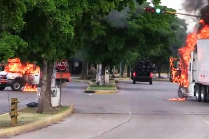 Trucks burn in Culiacan, capital of jailed Mexican druglord Joaquin "El Chapo" Guzman's home state of Sinaloa, on October 17, 2019