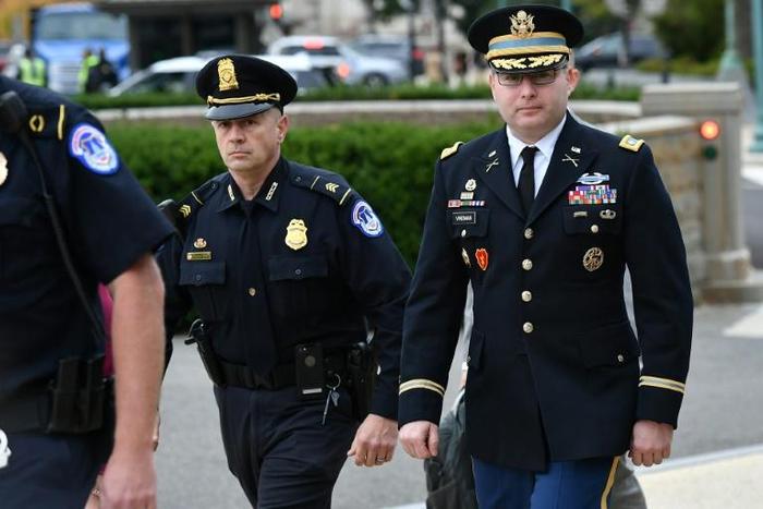 Lieutenant Colonel Alexander Vindman (R), a White House National Security Council Ukraine expert, arrives at Congress to testify in the impeachment inquiry against President Donald Trump