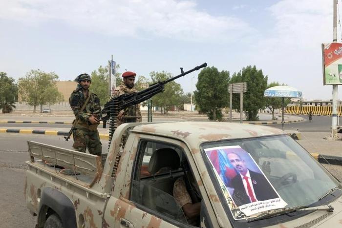 Fighters of the UAE-trained Security Belt Force, dominated by members of the Southern Transitional Council (STC) which seeks independence for south Yemen, patrol a street near the Aden International airport on August 28, 2019