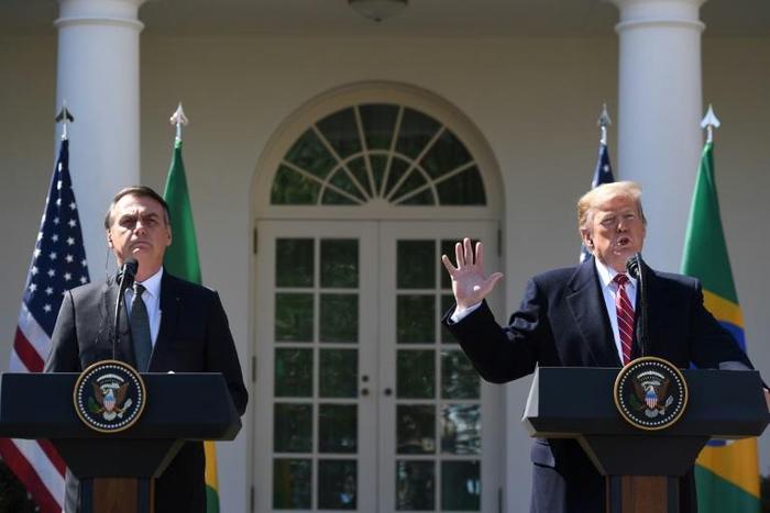 US President Donald Trump speaks during a joint press conference with Brazil's President Jair Bolsonaro in the Rose Garden at the White House