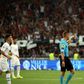 French referee Clement Turpin gestures as he haltes the game between Nice and Marseille after supporters shouted homophobic chants