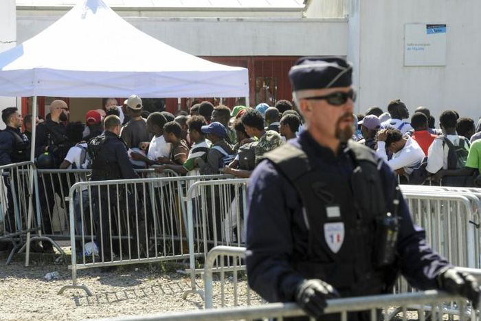 Macron says there has been a sharp increase in asylum claims since 2017