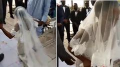Angry bride walks away from her wedding after kneeling down to apologise to her father