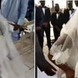 Angry bride walks away from her wedding after kneeling down to apologise to her father