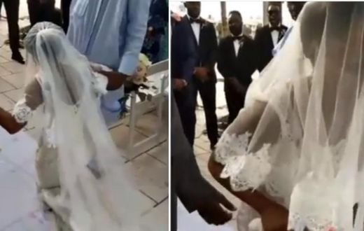 Angry bride walks away from her wedding after kneeling down to apologise to her father