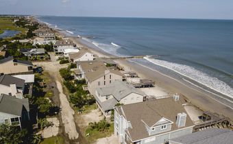 Rich Counties Get More Help to Escape Climate Risk, New Data Show