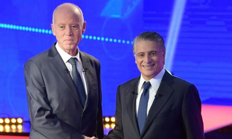 Conservative law professor Kais Saied (L) and business tycoon Nabil Karoui (R) go head-to-head in Tunisia's runoff presidential election