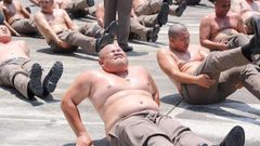 Overweight Thai police officers taken to fat burning camp to reduce pot-belly