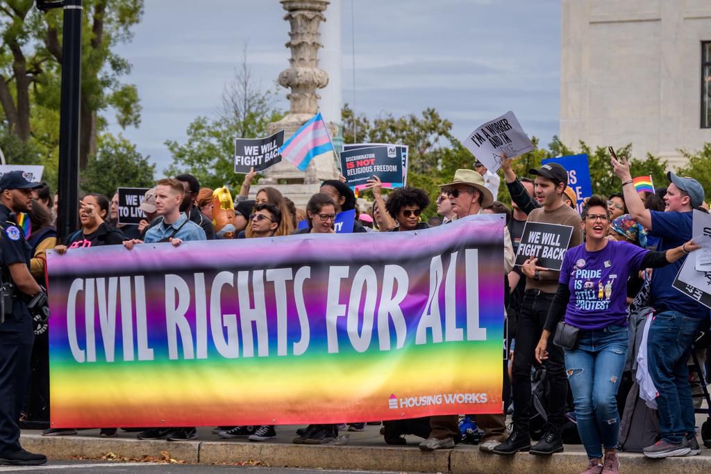 Protesters holding a banner outside the Supreme Court. 133...