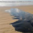 A barrel of oil leaking on a beach in Barra dos Coqueiros, in the Braziilian state of Sergipe