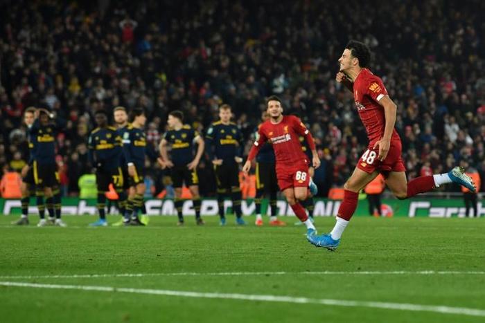 Liverpool's Curtis Jones celebrates after scoring the winning penalty against Arsenal