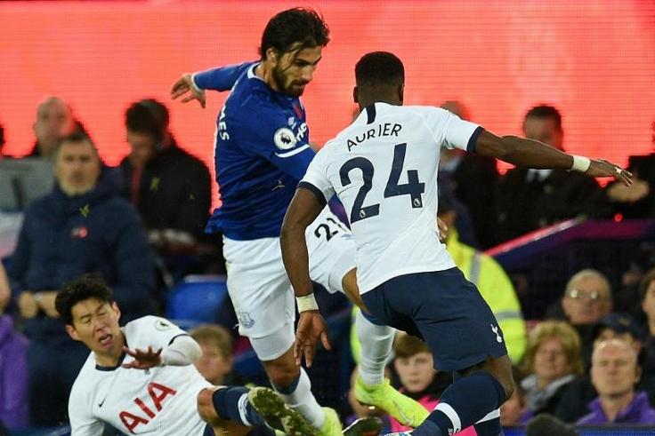 Everton midfielder Andre Gomes (centre) was injured following a challenge by Tottenham's Son Heung-min (left)