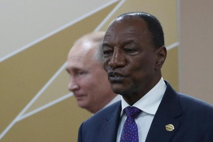 Tens of thousands of people have rallied in favor of Guinea's President Alpha Conde, pictured with Russian President Vladimir Putin October 24, 2019