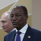 Tens of thousands of people have rallied in favor of Guinea's President Alpha Conde, pictured with Russian President Vladimir Putin October 24, 2019