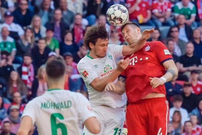 Bremen defender Milos Veljkovic (L) was sent off before Niklas Suele (R) sealed a late win for Bayern Munich on Saturday