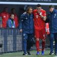 Niklas Suele was helped off after injuring his knee as Bayern drew at Augsburg