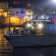 Italian authorities identified and carried out medical checks on the African migrants after they disembarked overnight on southern island Lampedusa after more than six days at sea