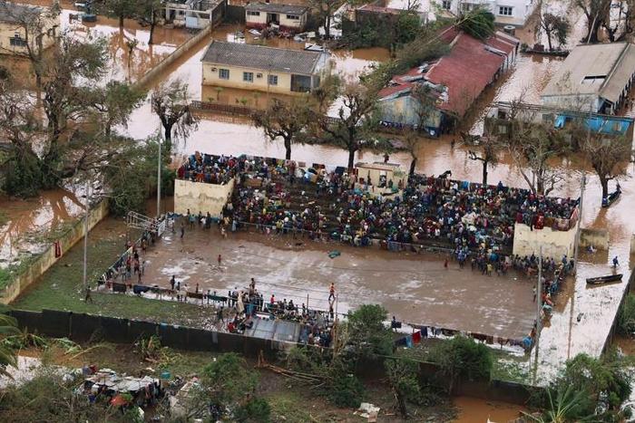 Stranded: Survivors of Cyclone Idai gather at the basketball stadium in Buzi, central Mozambique -- a relative haven from the flood water