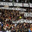 Metz' supporters hold banners that got their match with Paris Saint-Germain halted for three minutes
