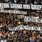 Metz' supporters hold banners that got their match with Paris Saint-Germain halted for three minutes