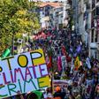 Demonstrators take part in a climate march in Hendaye, south-west France on August 24, 2019, to protest against the annual G7 Summit