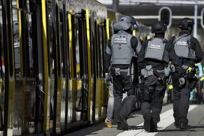 Armed police and emergency services swarmed the scene after the shooting in the city of Utrecht