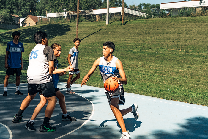 <strong> </strong><strong>SUMMERTIME AT THE SLAB:</strong> Justin Kitcheyan, 15, drives to the hoop. From left: Drew PArker, 18; Ed Payer, 17; Dyami Berridge, 13; and Jamison Smith, 15.