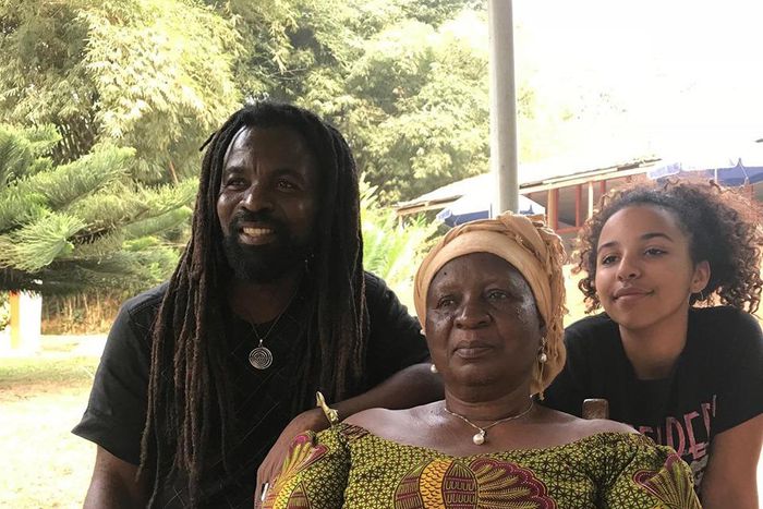 Rocky Dawuni, with his late mother and daugter