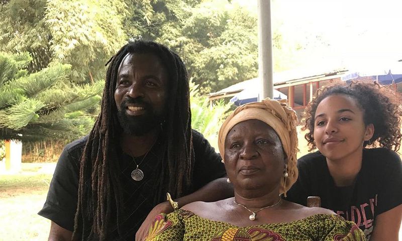 Rocky Dawuni, with his late mother and daugter
