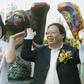 Former Hong Kong home affairs secretary Patrick Ho Chi Ping (R), pictured in a 2003 photograph with movie star Jackie Chan, was sentenced to three years in prison over a bribery scheme