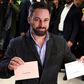 Vox's far-right candidate Santiago Abascal poses with his ballots in Madrid as his party looks for a surge in support
