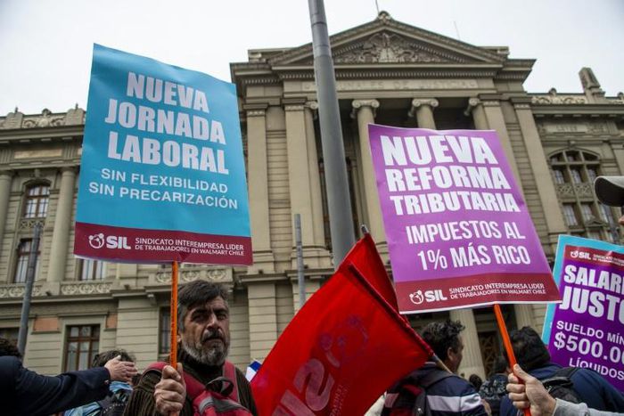 Demonstrators against the government economic policies in front of the palace of the Courts in Santiago
