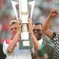Then South Africa president Nelson Mandela (R) celebrates as captain Neil Tovey (L) holds the Africa Cup of Nations trophy after defeating Tunisia in the 1996 final