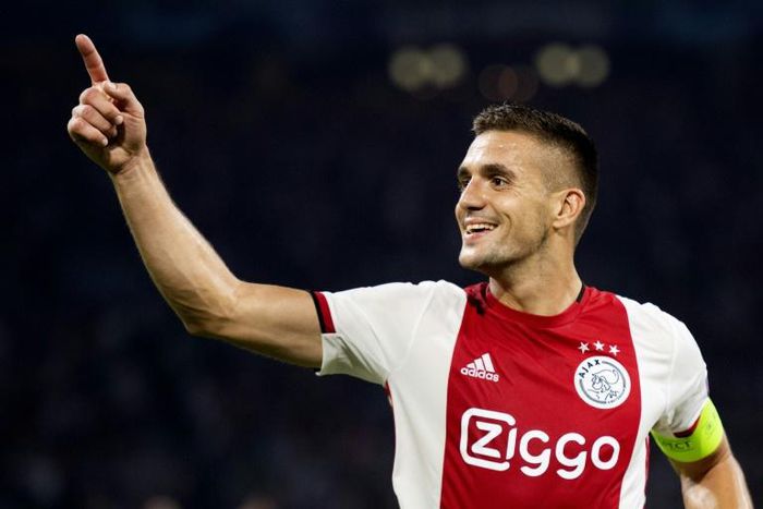 Captain Dusan Tadic scored Ajax's second goal as the Dutch champions beat APOEL 2-0 to secure their place in Thursday's draw for the Champions League group stage