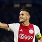 Captain Dusan Tadic scored Ajax's second goal as the Dutch champions beat APOEL 2-0 to secure their place in Thursday's draw for the Champions League group stage