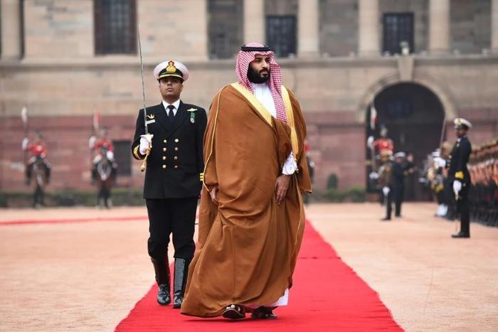 Saudi Crown Prince Mohammed bin Salman (C), pictured in India, authorized the Rapid Intervention Group to suppress dissidents, The New York Times reported