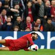 Down and out: Mohamed Salah will miss Sunday's clash with Manchester United due to an ankle injury