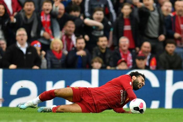 Down and out: Mohamed Salah will miss Sunday's clash with Manchester United due to an ankle injury